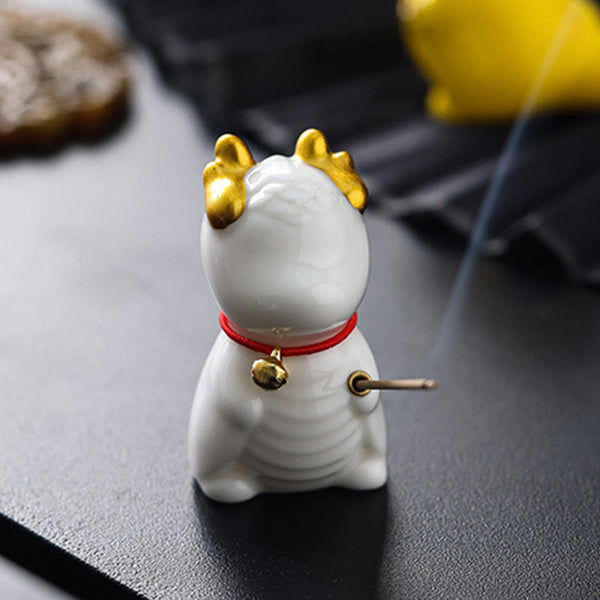 Ceramic Dragon Bell Incense Burner – white cat lucky cat variant with incense in paws, bokeh foliage, Whimsical