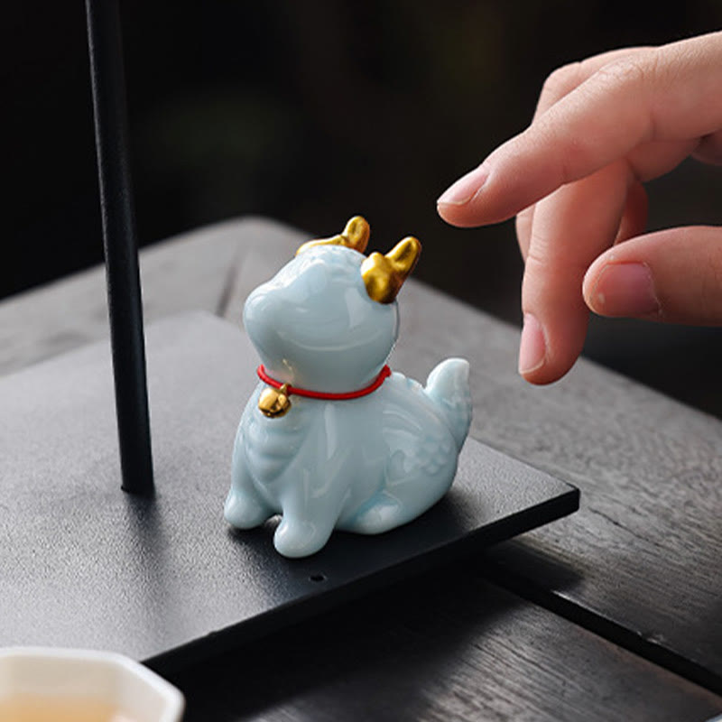 Ceramic Dragon Bell Incense Burner – celadon with finger reaching to touch, interactive scale, Delight