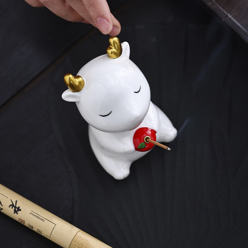 Deer Ceramic Incense Burner – White deer with finger touching gold antler, incense smoke, ceramic incense accessory