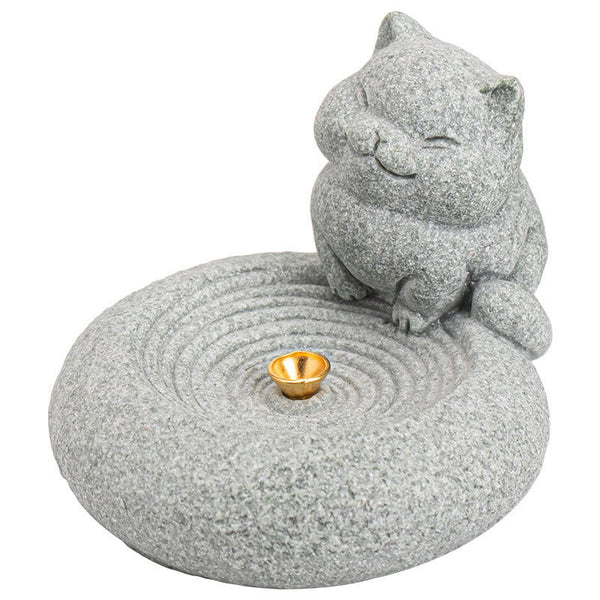 Lazy Cat Sandstone Incense Burner – cat on pure white background, zen ripple base with gold incense holder, e-commerce studio