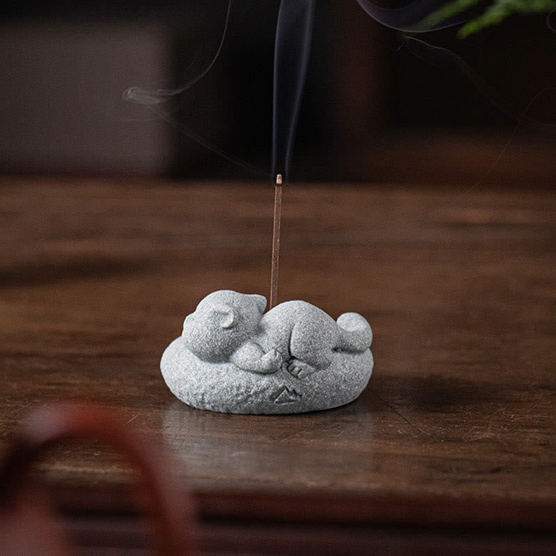 Lazy Cat Sandstone Incense Burner – cat on aged wood with notebook and plant, incense burning, slow living scene
