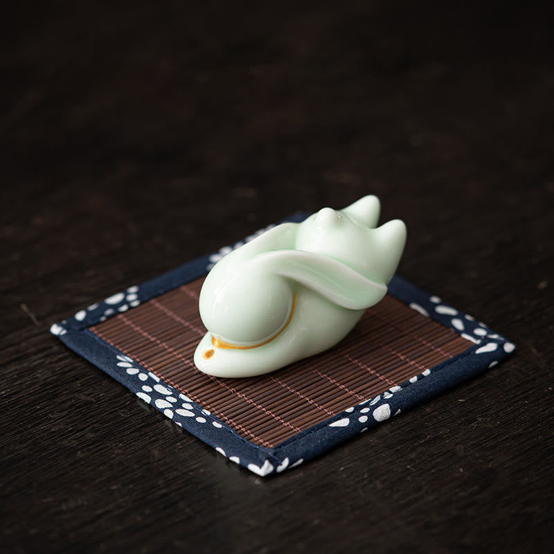 Flying Rabbit Ceramic Incense Burner – red glossy rabbit on dark wood, ceramic incense burner