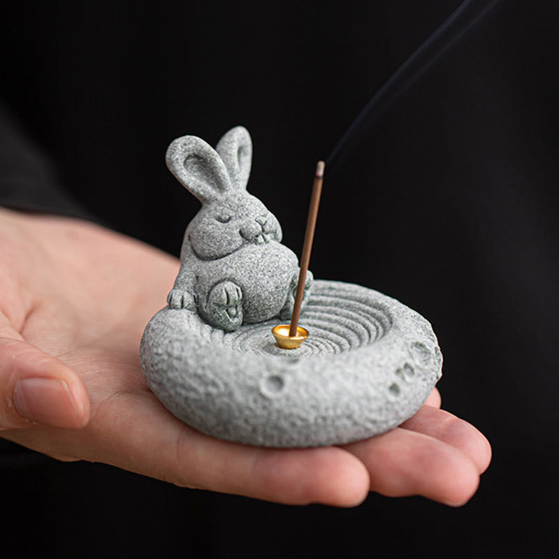 Chinese Zodiac Sandstone Incense Burner – rabbit held in palm, black background, meditating jade rabbit zen decor