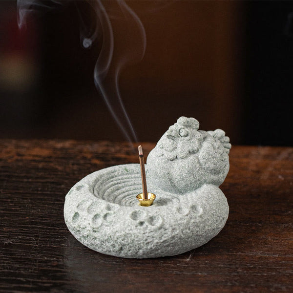 Chinese Zodiac Sandstone Incense Burner – lounging cat on dark wood with smoke, books in background, cozy zen lifestyle shot
