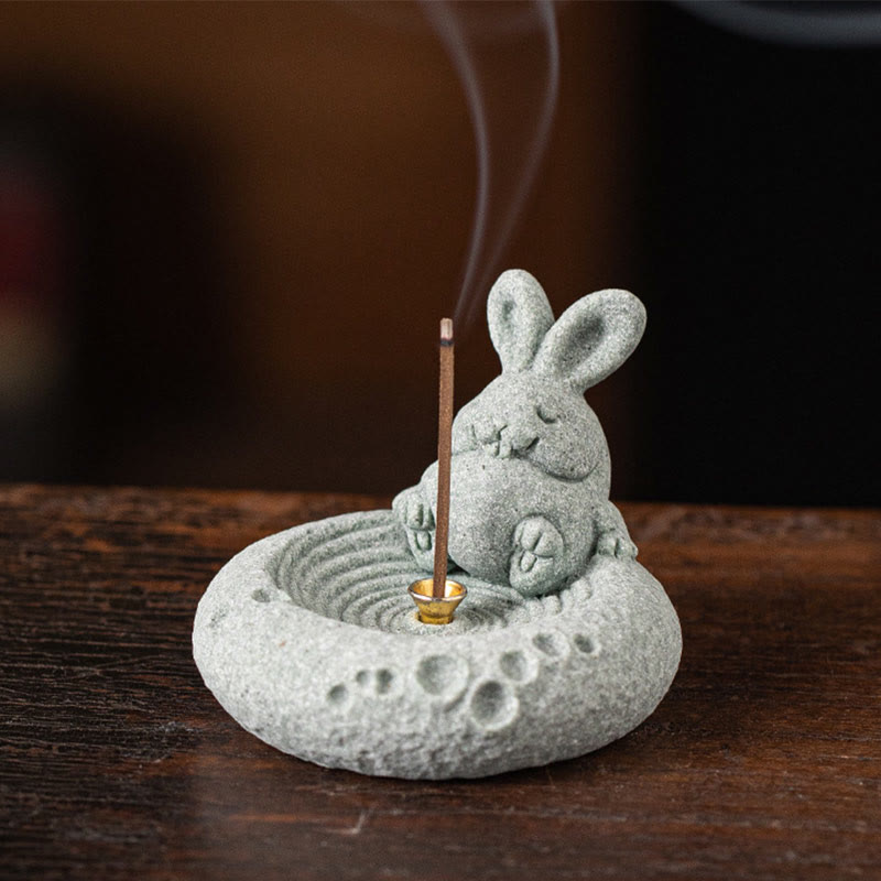 Chinese Zodiac Sandstone Incense Burner – rabbit with burning incense on dark wood, moon crater base, paw print accents