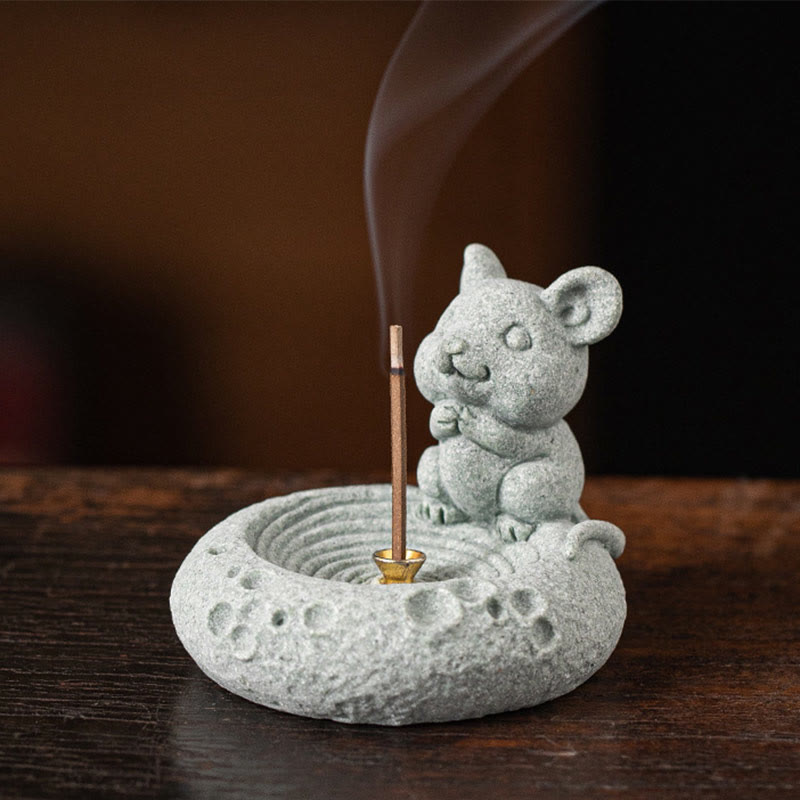 Chinese Zodiac Sandstone Incense Burner – mouse/rat zodiac figure with lit incense, dark wood surface, smoke rising