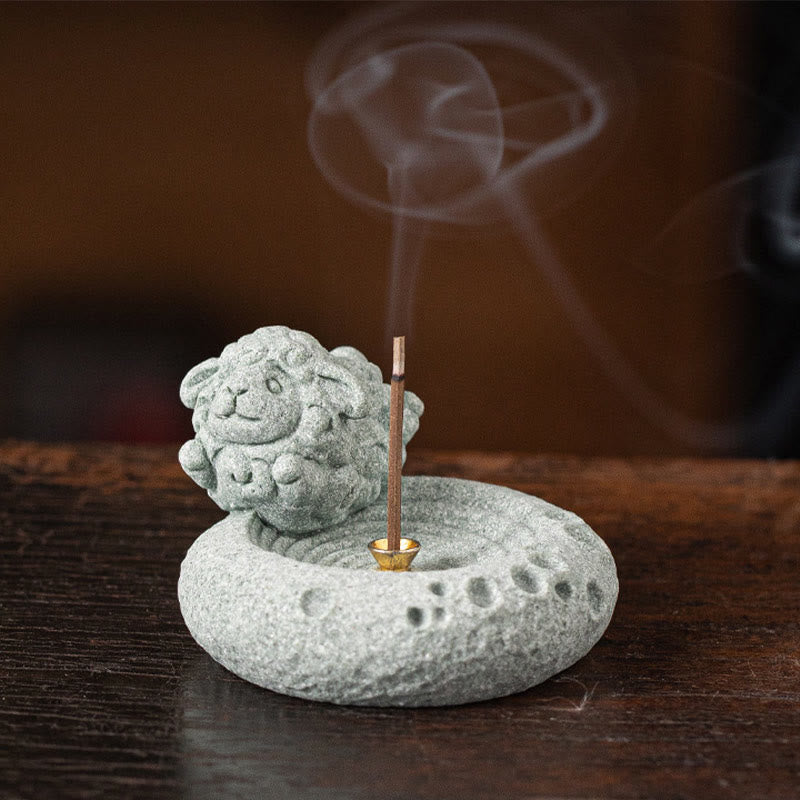 Chinese Zodiac Sandstone Incense Burner – baby monkey with incense smoke, warm brown bokeh, cute primate zodiac figurine