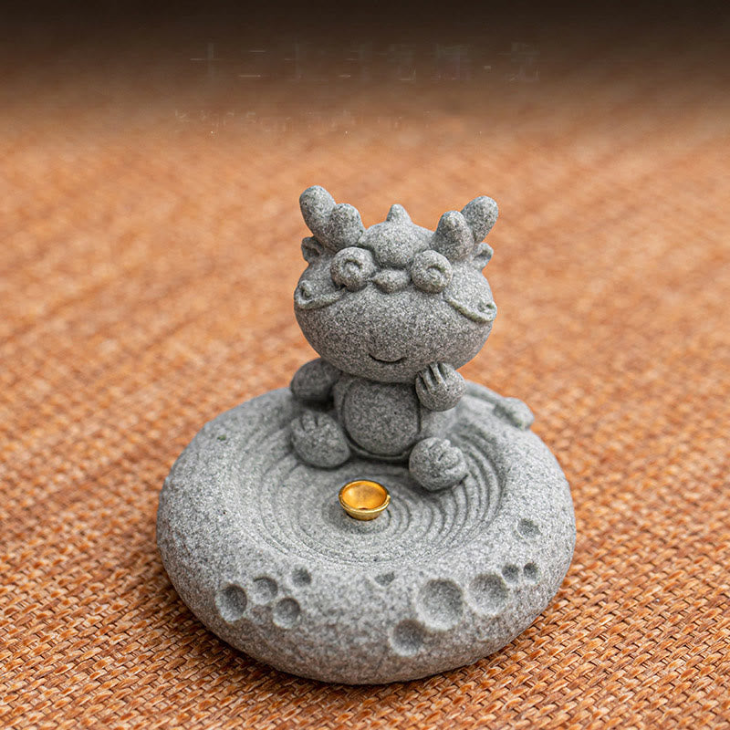 Chinese Zodiac Sandstone Incense Burner – cat base close-up on dark wood, ripple pattern and brass socket, zen garden detail