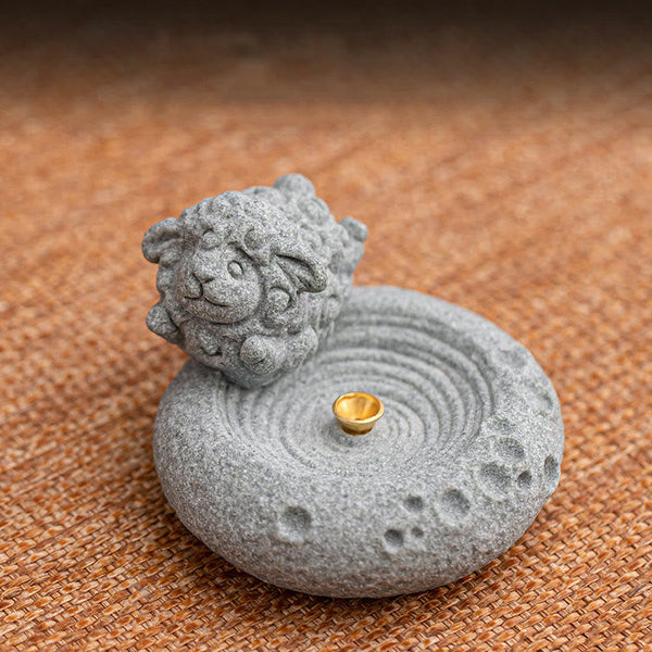 Chinese Zodiac Sandstone Incense Burner – meditating monkey held near hand, woven mat, smoke trail, calm zen aesthetic