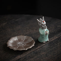 Ceramic Dragon King Incense Burner – celadon robed figure with lotus base on dark wood, two-piece set, Tradition