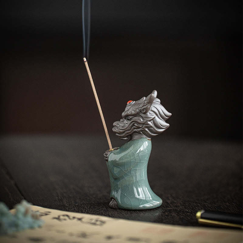 Ceramic Dragon King Incense Burner – close-up held in hand showing scale and gold chest ornament, Intimate