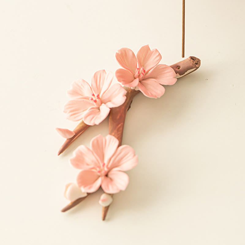 Plum Blossom Incense Burner – Three pink ceramic flowers on brown branch with incense stick, sakura decor