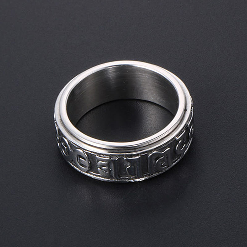 Silver Tibetan Spinner Ring on dark background, meditation worry ring