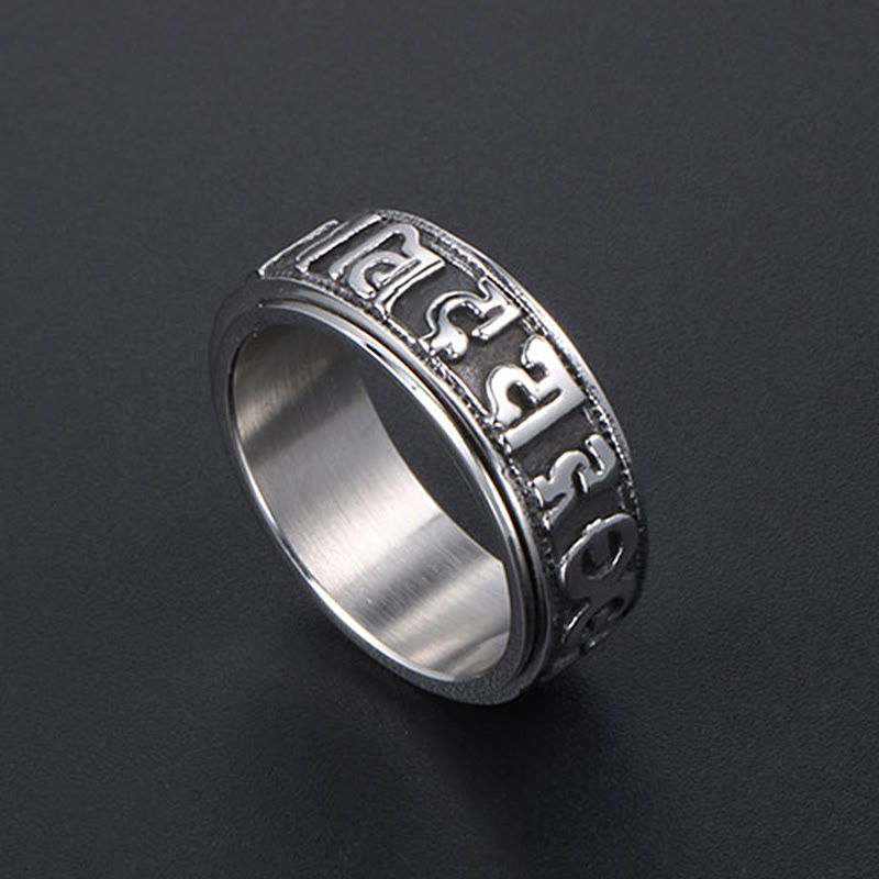Silver Tibetan Spinner Ring dark background, Om mantra worry ring