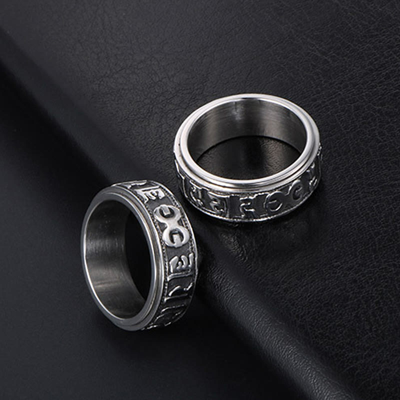 Two Tibetan Spinner Rings on black leather, silver mantra rings