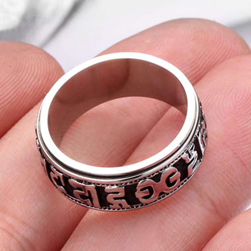Tibetan Spinner Ring worn on hand, silver worry ring close-up