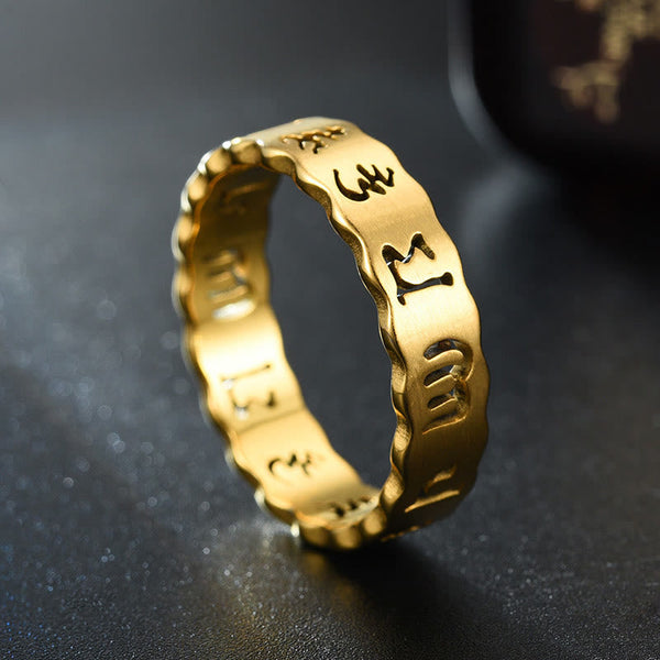 Titanium Steel Om Mani Padme Hum Spinner Ring – gold band side angle on dark, mindful peace