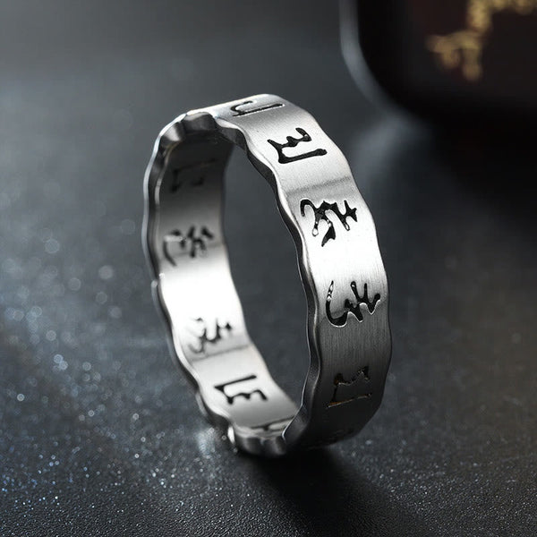 Titanium Steel Om Mani Padme Hum Spinner Ring – silver etched band on black, calm strength