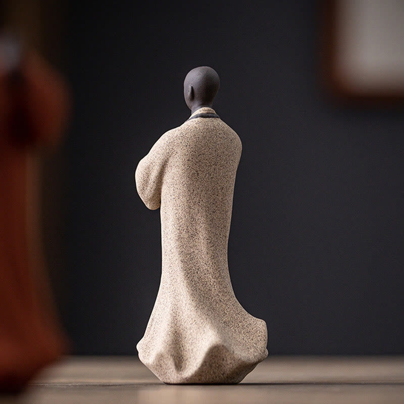 Ceramic Meditating Monk Figure – in bathroom spa setting, tranquility decor element