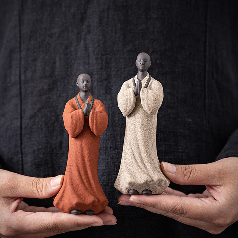 Ceramic Meditating Monk Figure – rustic ceramic texture close-up, handcrafted pottery