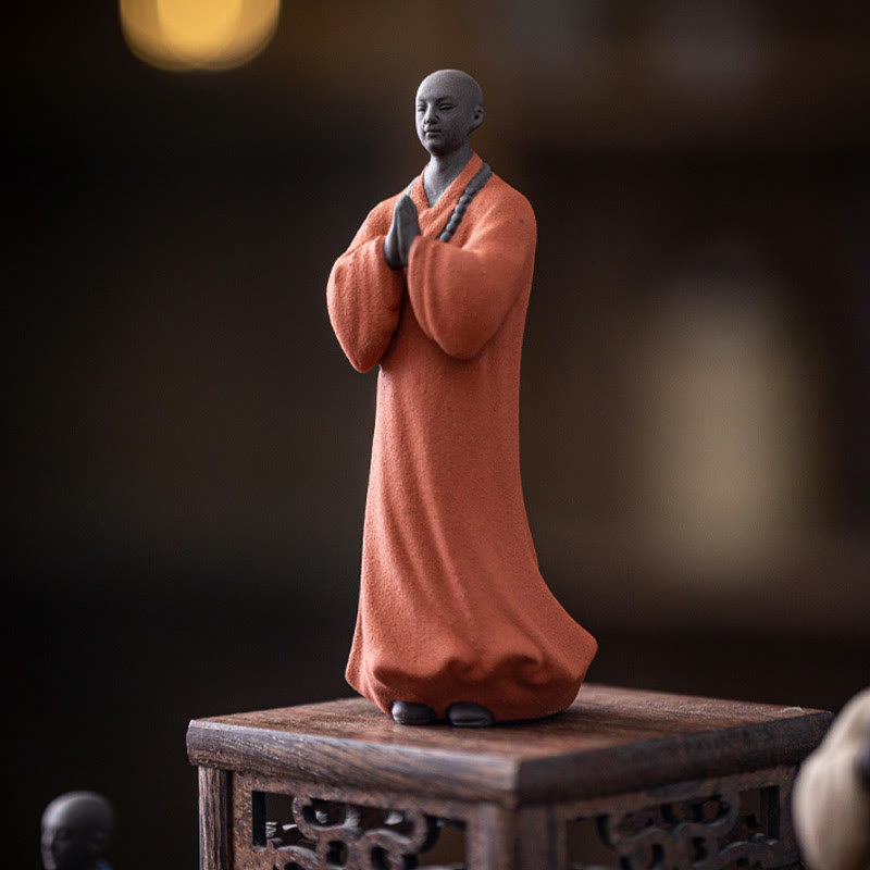 Ceramic Meditating Monk Figure – size comparison with tea cup, compact desk ornament