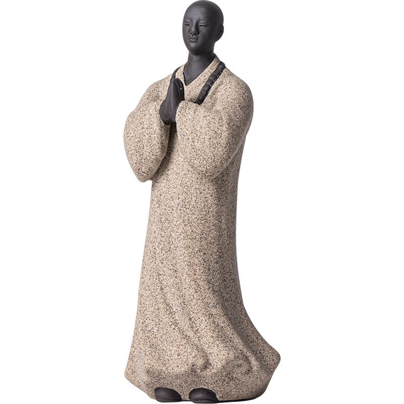Ceramic Meditating Monk Figure – on desk with laptop, office stress relief decoration