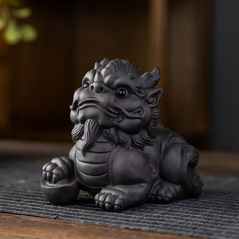 PiXiu Ingot Ball Purple Clay Tea Pet – Front close-up of black clay PiXiu face and paws, detailed carving texture