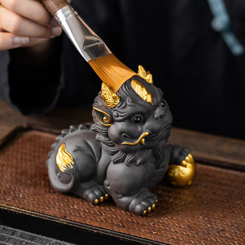 PiXiu Ingot Ball Purple Clay Tea Pet – Tea brush pouring over gold-accented PiXiu on tea tray, tea pet care ritual