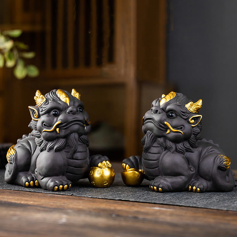 PiXiu Ingot Ball Purple Clay Tea Pet – Pair of black PiXiu with gold accents on wooden tea mat, feng shui wealth decor