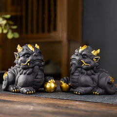 PiXiu Ingot Ball Purple Clay Tea Pet – Pair of black PiXiu with gold accents on wooden tea mat, feng shui wealth decor