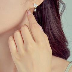Hetian Jade & Sterling Silver Lotus Moon Earrings - silver lotus earring on ear, warm soft lighting, feminine style