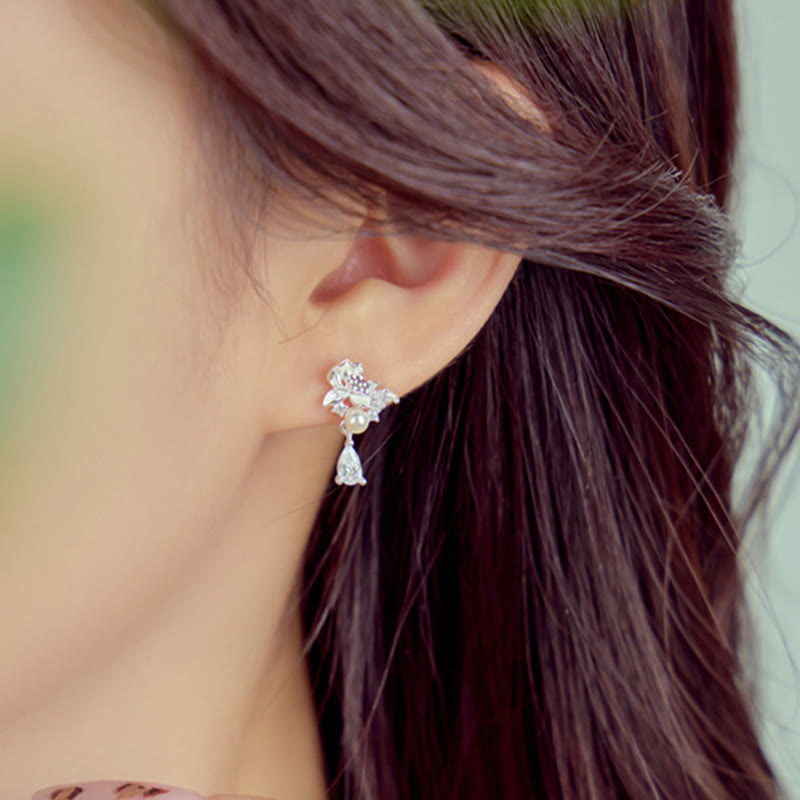Hetian Jade & Sterling Silver Lotus Moon Earrings - silver pearl dangle earring close-up profile, warm daylight
