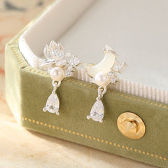 Hetian Jade & Sterling Silver Lotus Moon Earrings - asymmetrical lotus and moon studs on green velvet box, elegant