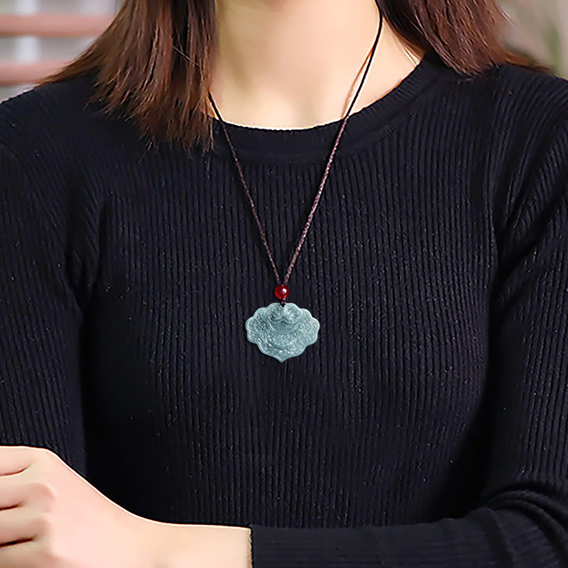 Lotus Pattern Carved Jade Pendant Necklace - worn on model with black sweater, carved jade pendant lifestyle