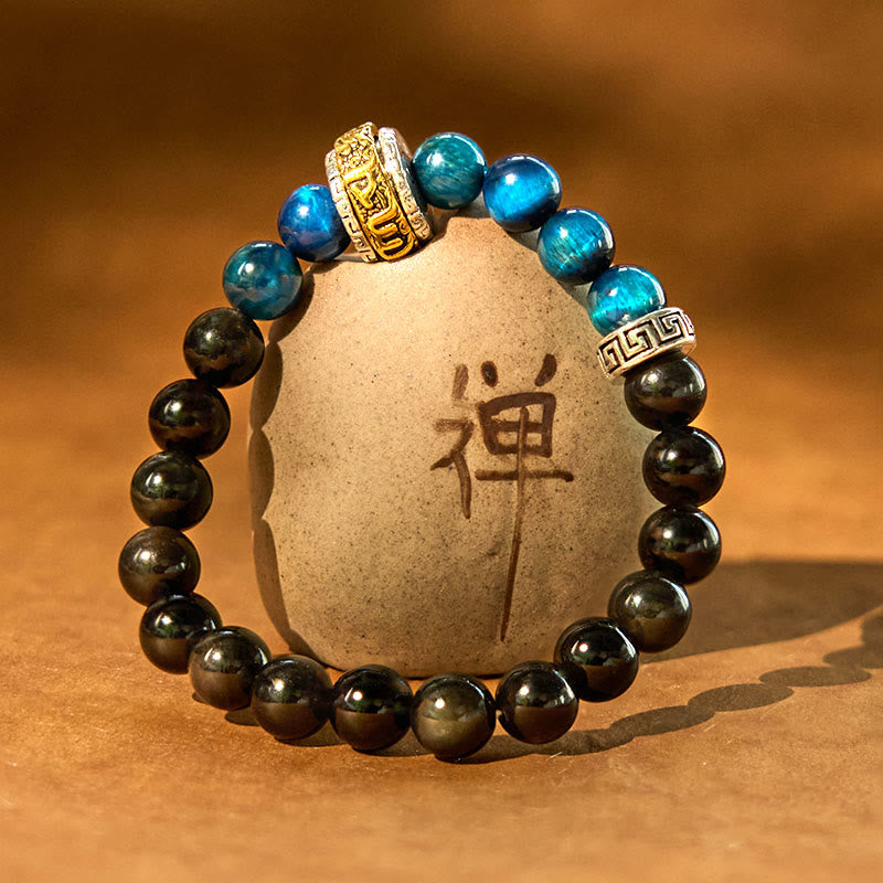 Om Mani Padme Hum Bracelet – Blue tiger eye and obsidian beads on Zen stone prop, spiritual jewelry