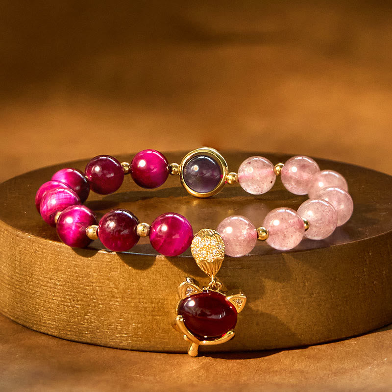 Natural Strawberry Quartz Love Bracelet – gold display stand warm lighting pink magenta beads
