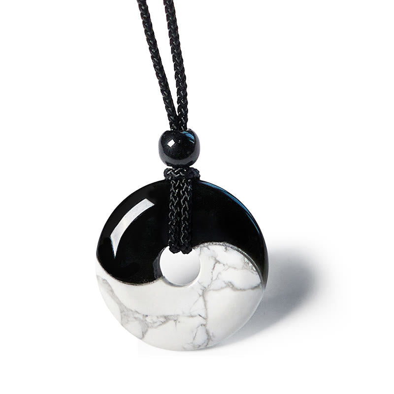 Obsidian White Turquoise Yin Yang Peace Buckle Necklace - Clean white background shot of yin-yang pendant with mirror-glos...