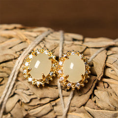 Hetian Jade Copper Earrings - dual angle on dried botanical with twine, warm organic styling