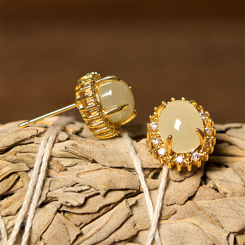 Hetian Jade Copper Earrings - front and profile on dried flower head, post mechanism visible, detailed