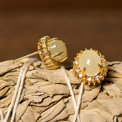 Hetian Jade Copper Earrings - front and profile on dried flower head, post mechanism visible, detailed
