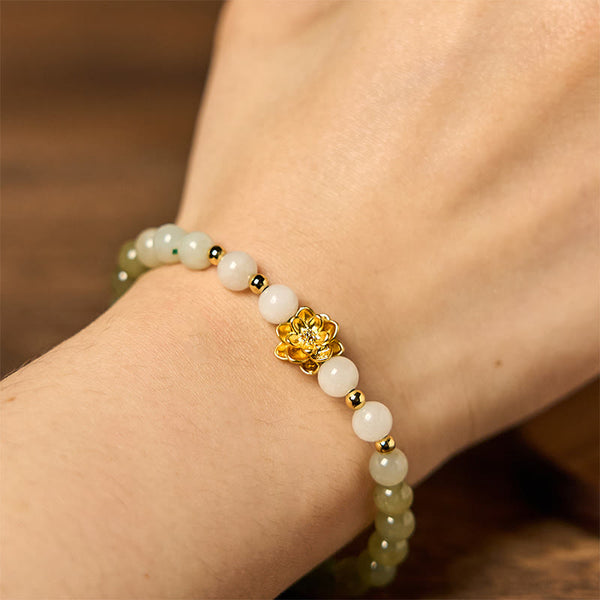 Hetian Jade Gradient Lotus Bracelet – on wrist, gold lotus charm and jade gradient close-up, Graceful
