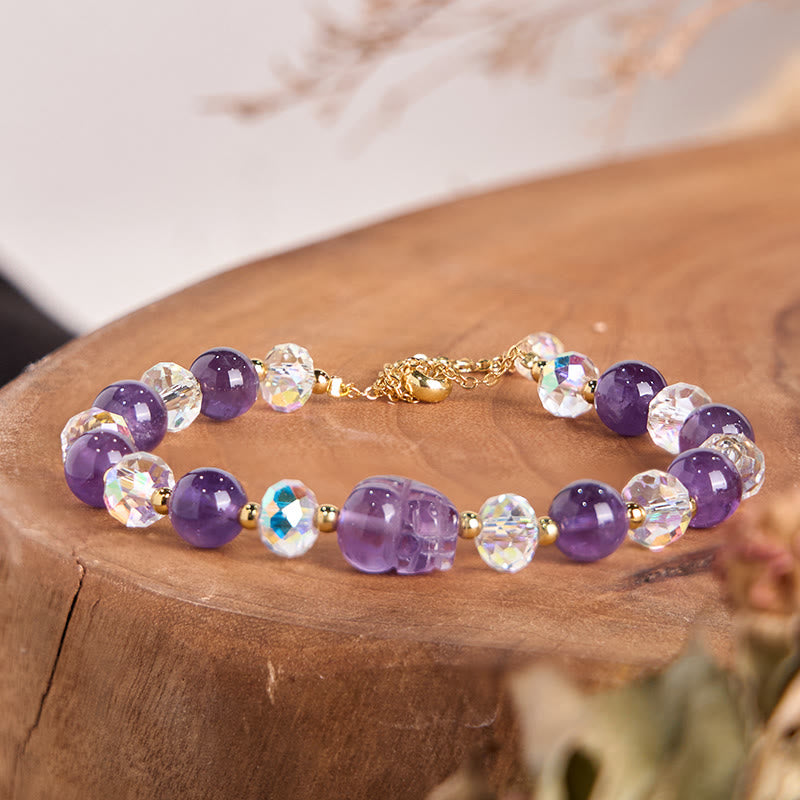 Amethyst PiXiu Bracelet – Purple amethyst and faceted crystal beads with PiXiu on wood stump, gold chain, balance jewelry