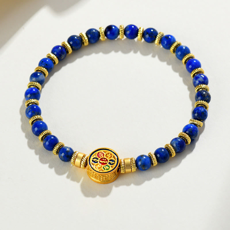 Lapis Lazuli Bracelet – circular on white surface with six section enamel mantra medallion detail, balance serenity