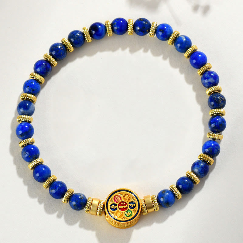Lapis Lazuli Bracelet – top down circular arrangement on white with gold spacers and enamel medallion, balance