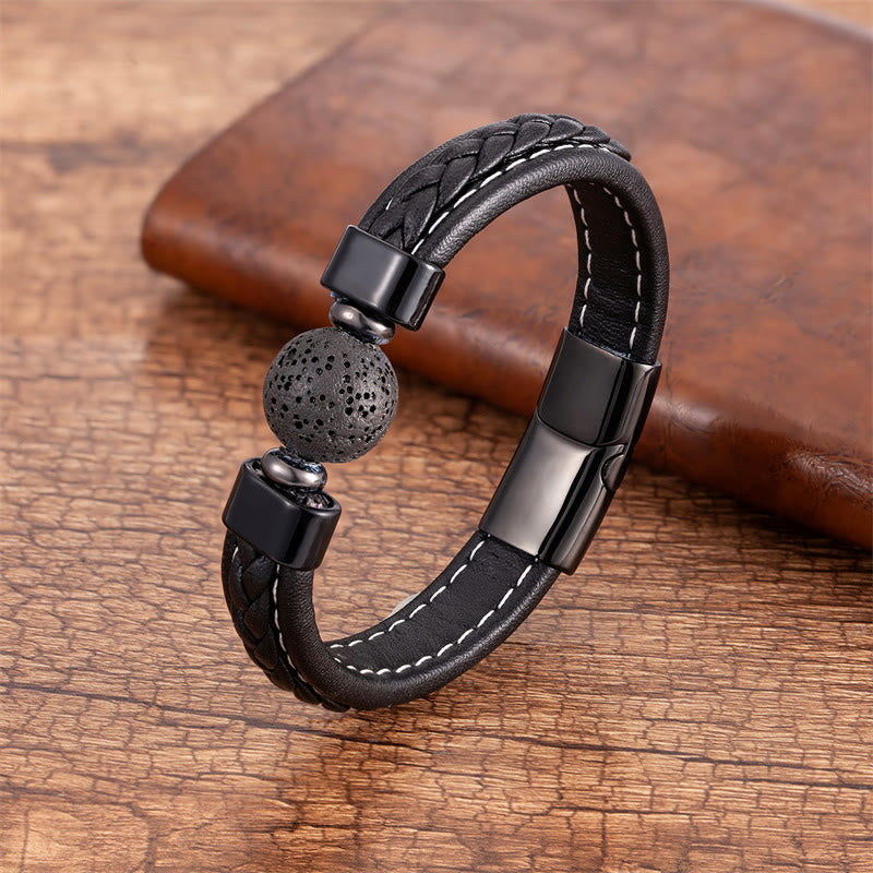 Mantra Leather Bracelet - Black braided band with porous lava rock bead on aged wood, lava stone bracelet