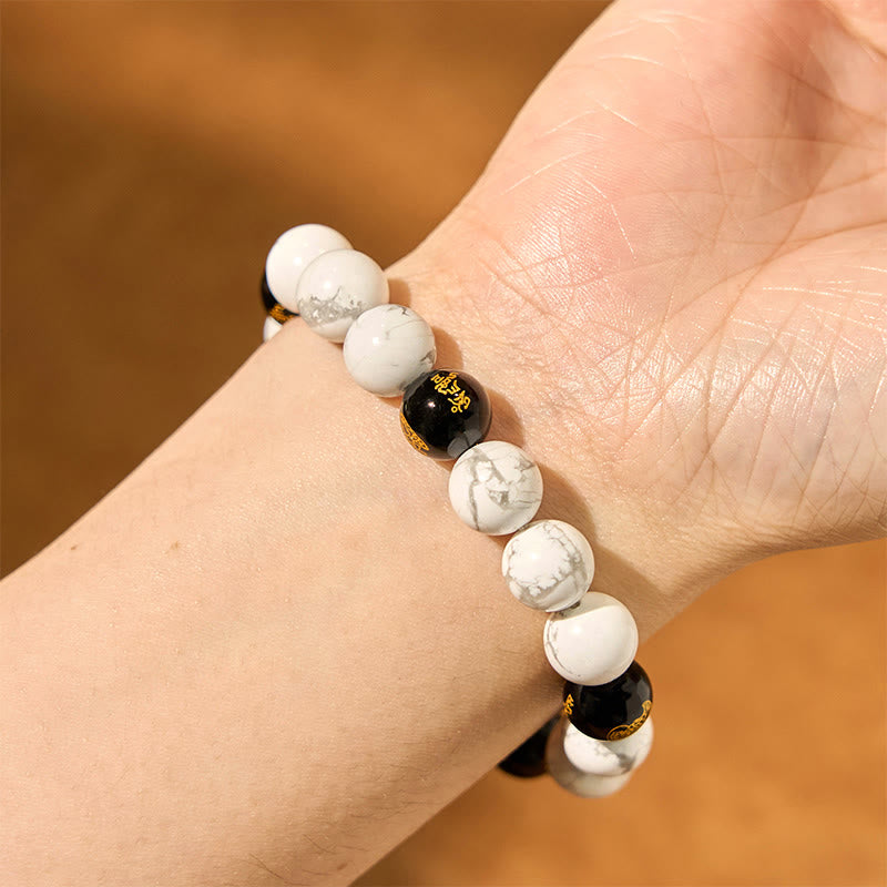 Vintage White Turquoise Black Onyx PiXiu Blessing Bracelet – side wrist shot with white and black beads on brown, fortune