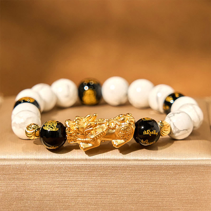 Vintage White Turquoise Black Onyx PiXiu Blessing Bracelet – gold PiXiu with white turquoise and black onyx on beige fabric
