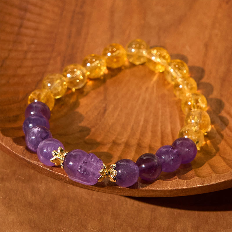 Citrine Amethyst PiXiu Prosperity Bracelet – purple PiXiu with yellow citrine and purple beads on carved wooden plate