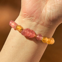 Strawberry Quartz PiXiu Rutilated Quartz Healing Bracelet – wrist view with pink strawberry quartz PiXiu on warm brown skin