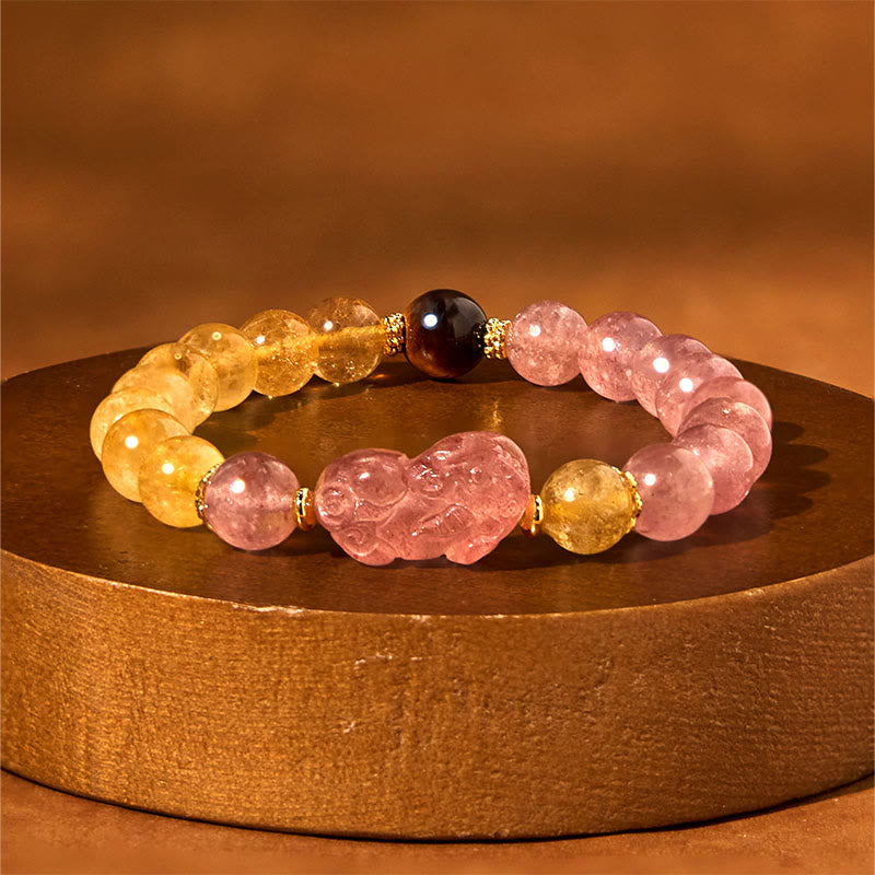 Strawberry Quartz PiXiu Rutilated Quartz Healing Bracelet – pink strawberry quartz PiXiu with rutile on gold display stand